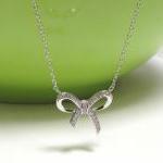 Adorable Infinity Bow Necklace In Rhodium Over..